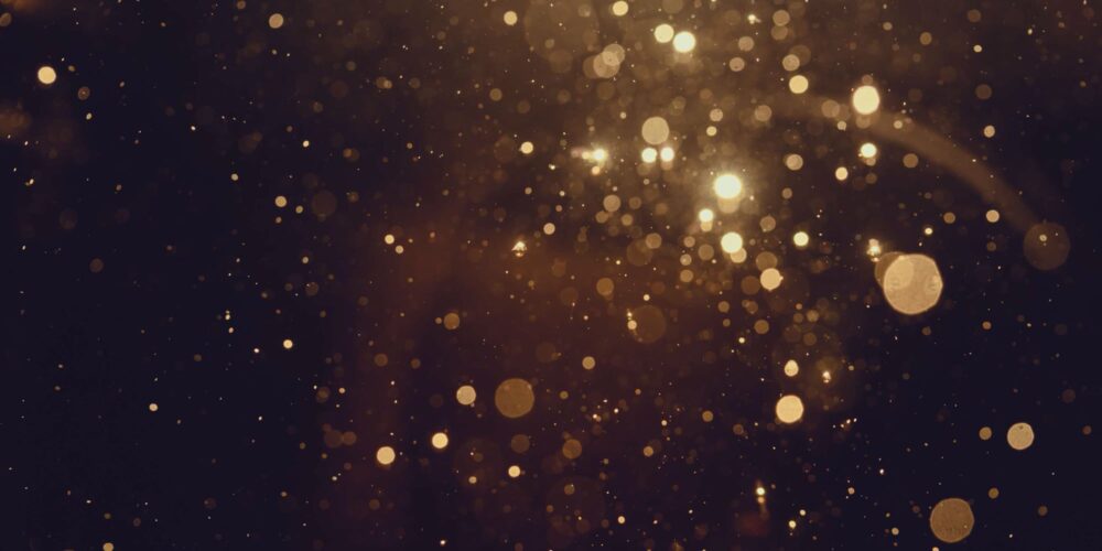 Glitter falling in a dark background